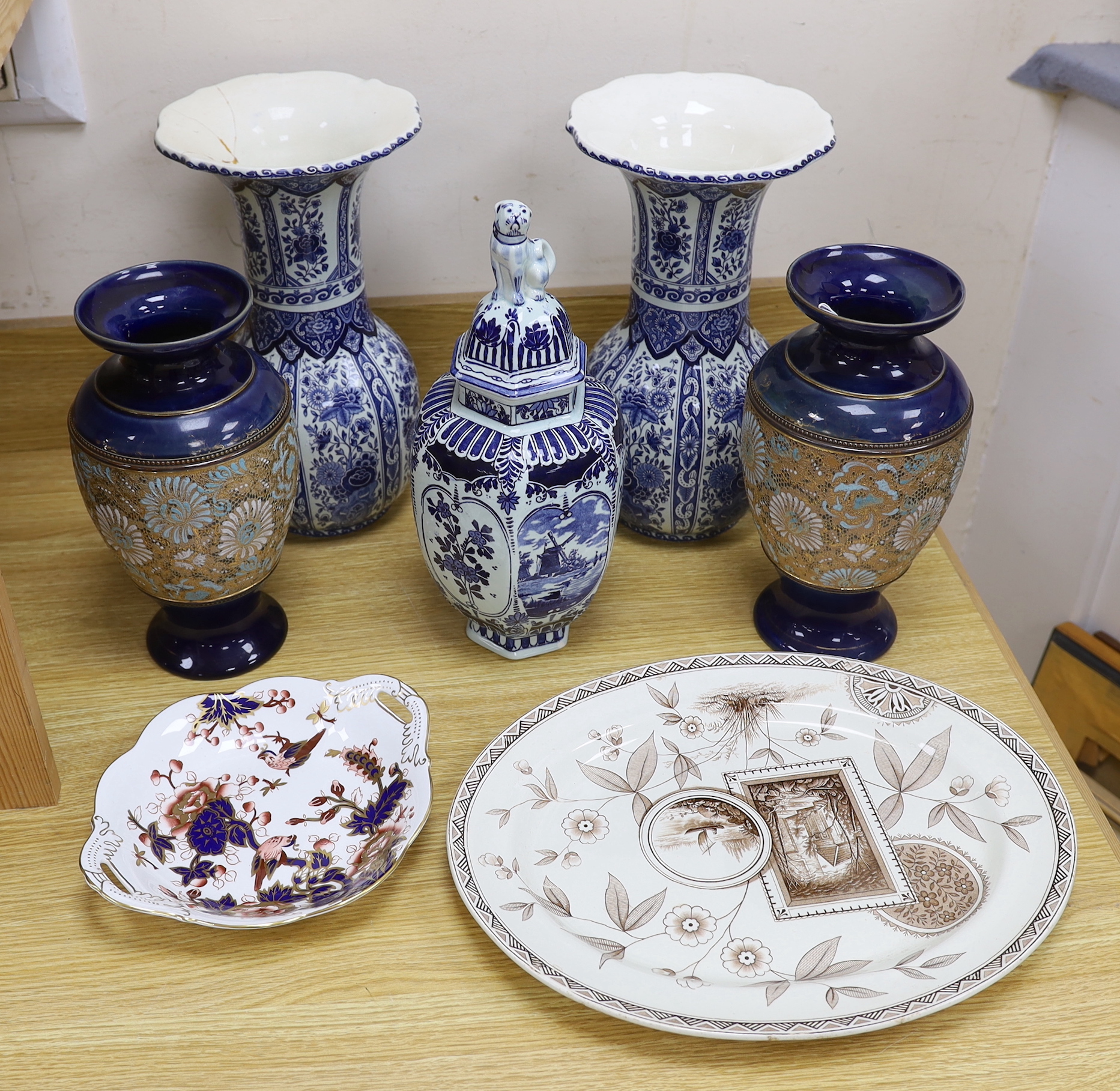 Seven ceramic pieces including a pair of Royal Doulton vases, Coalport dish and Delft jar and cover, 34cm high